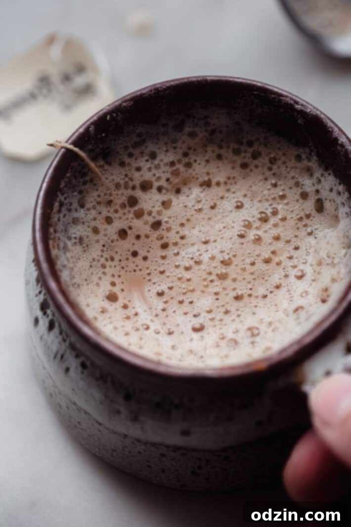 Effortless London Fog Latte 7 foamy milk on a latte in brown mug