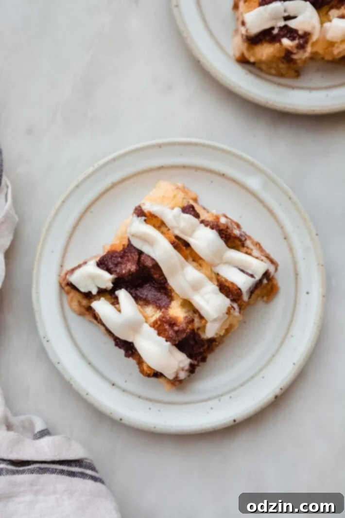 piece of cinnamon roll casserole on speckled plate
