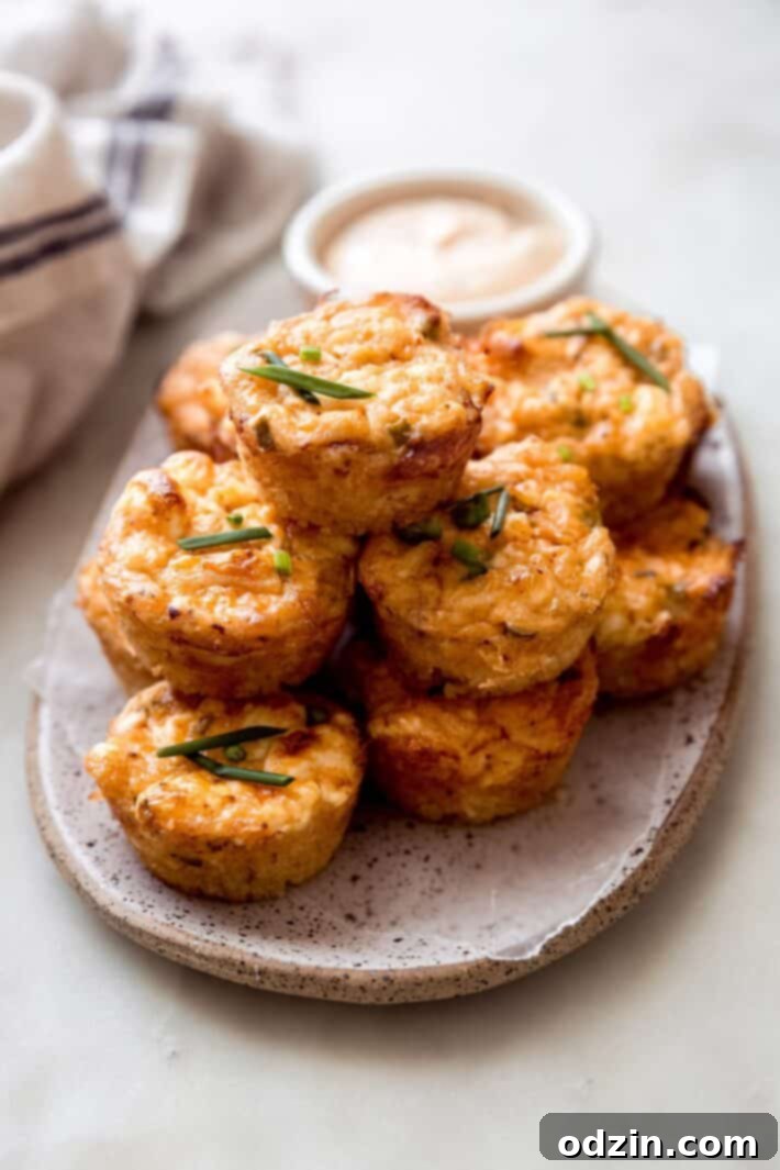 crab cake bites on a speckled tray on white marble surface