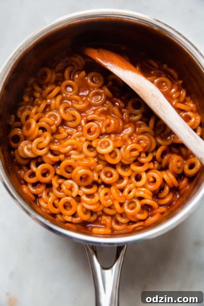 Comforting Homemade Pasta O's 5 saucepan with prepared spaghettiOs