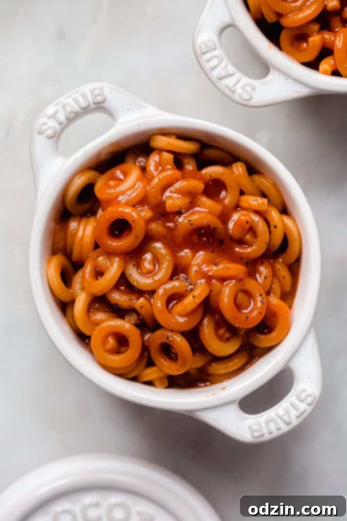 Comforting Homemade Pasta O's 6 casserole pan with prepared spaghetti hoops in tomato sauce