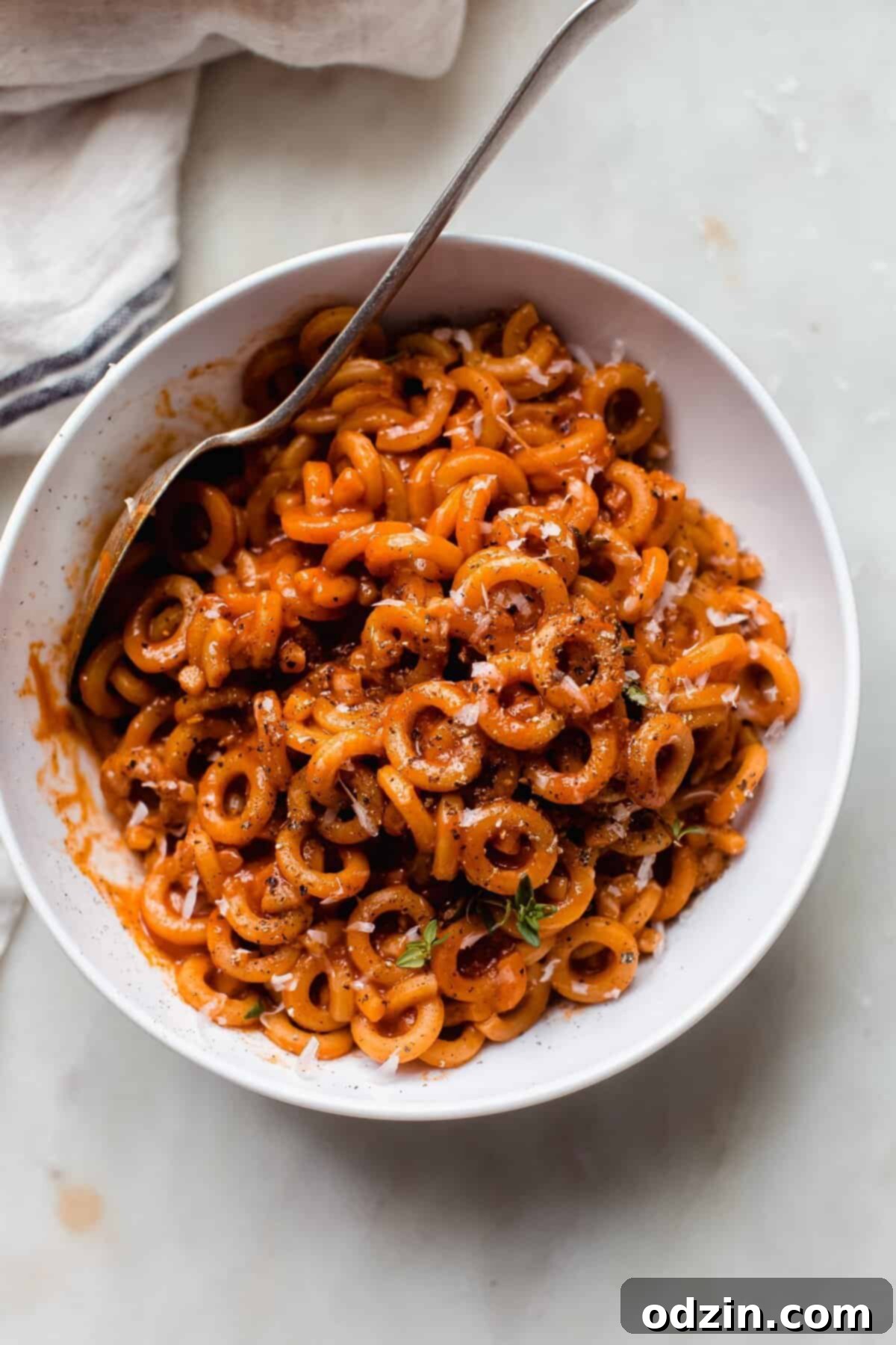 Comforting Homemade Pasta O's 7 bowl of spaghettiOs on white marble