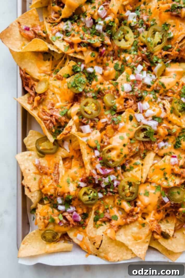 prepared bbq chicken nachos on sheet pan