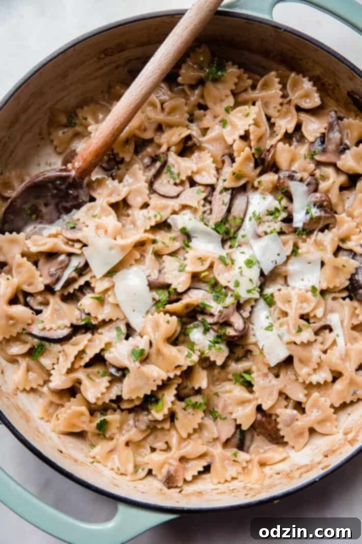 close up of one pot creamy mushroom pasta in cast iron pan