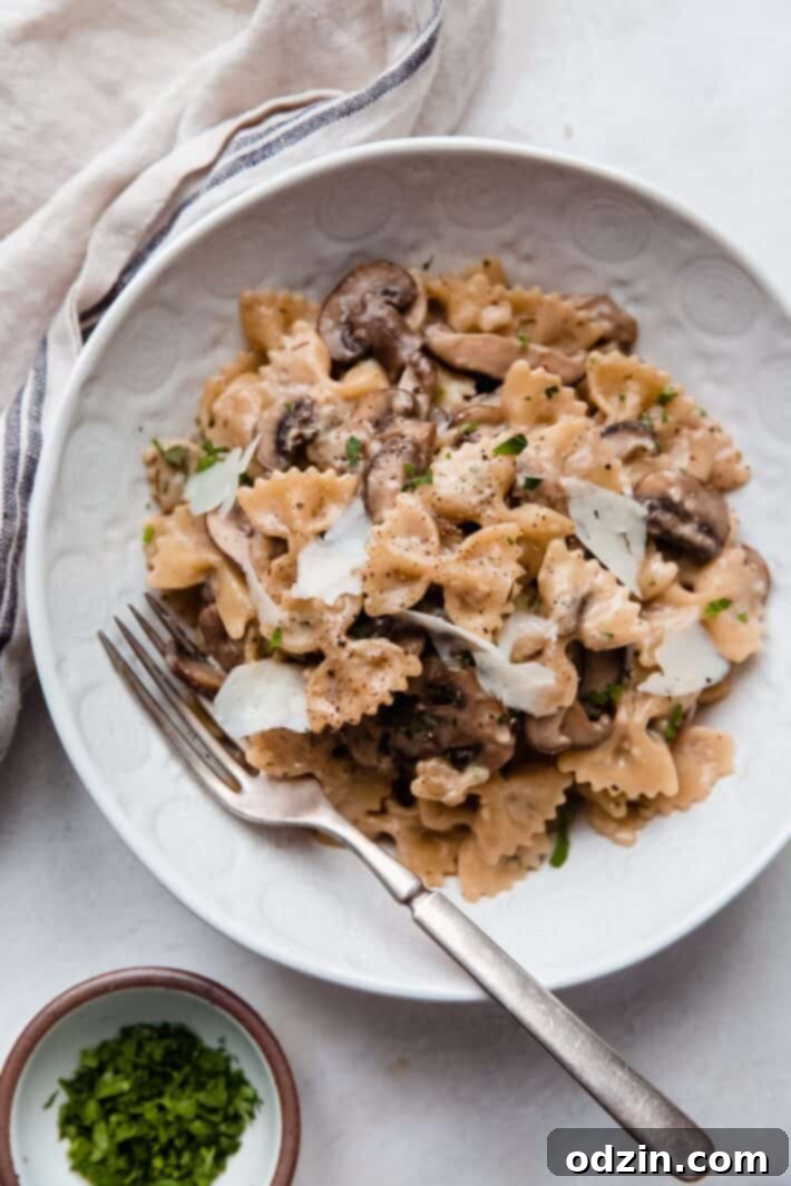 bowls itv pasta, fork, on white marble with linen towel