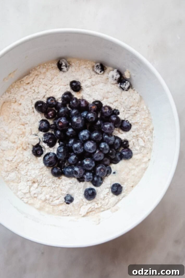 batter for waffles with fresh blueberries