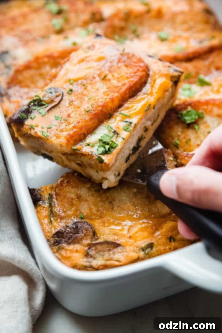 cheddar hash brown casserole slice on spatula