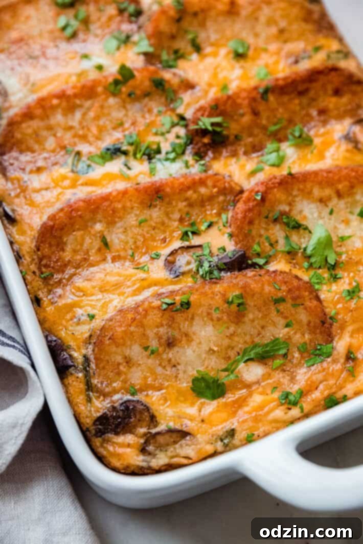 cheddar hash brown casserole in dish on white marble