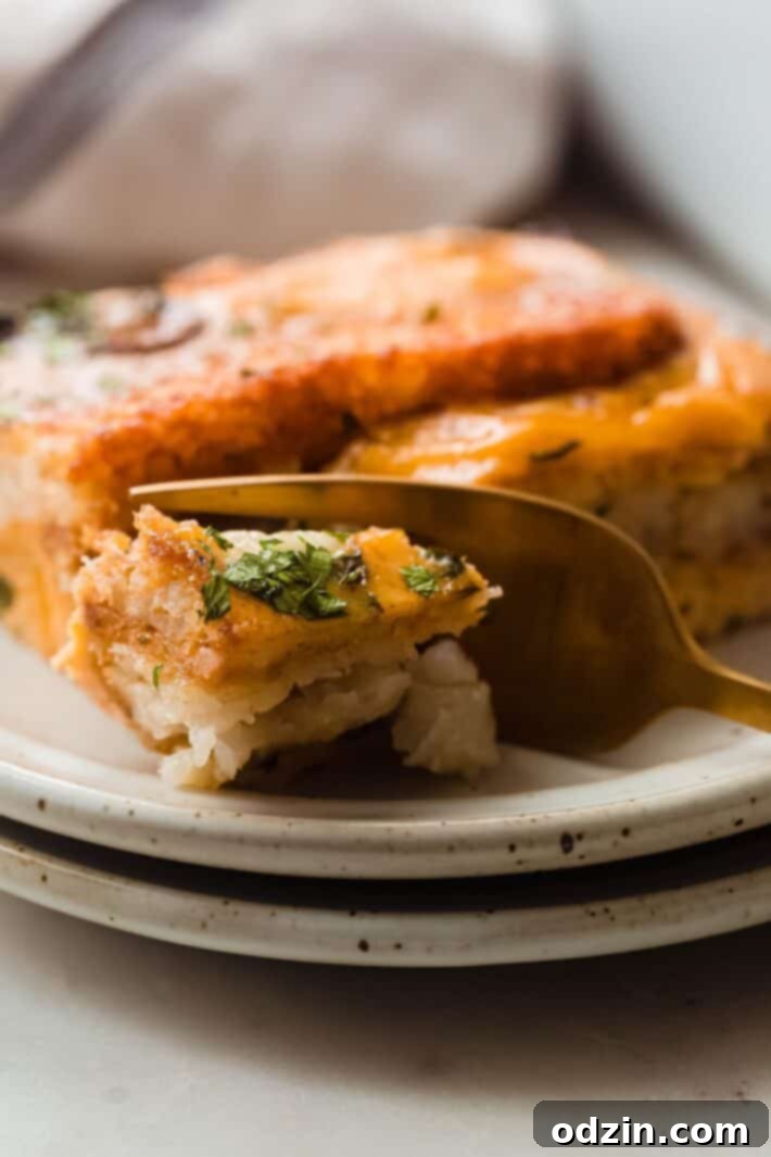 broke piece of casserole on plate with fork 