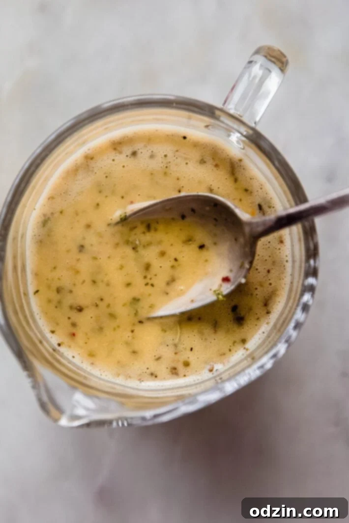 spoon showing texture of Italian dressing