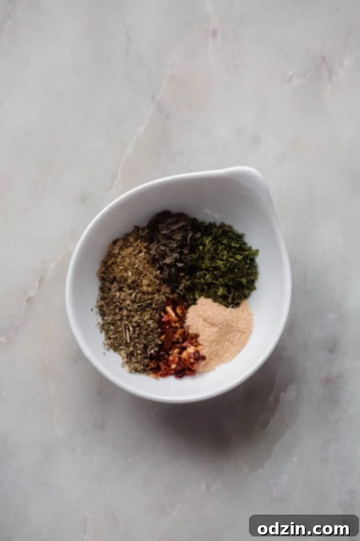 seasonings in Italian dressing in white pinch dish
