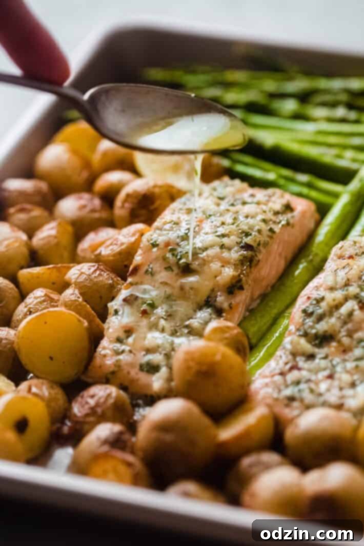 melted garlic butter being pour on salmon fillet