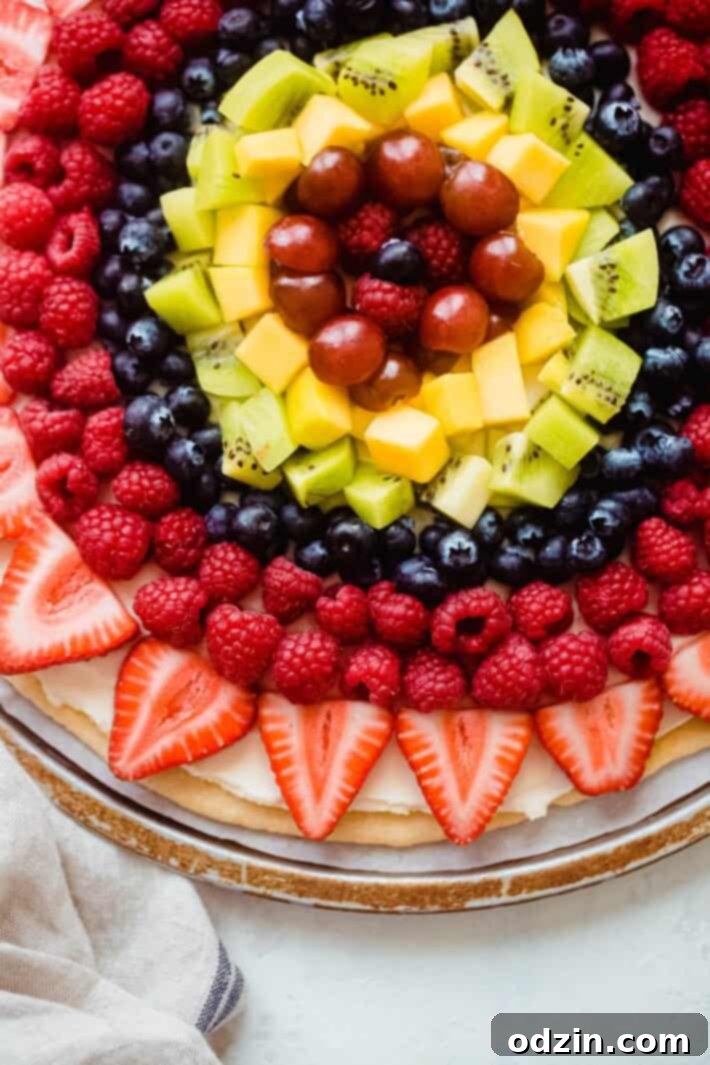 colorful homemade fruit pizza with various fresh fruits