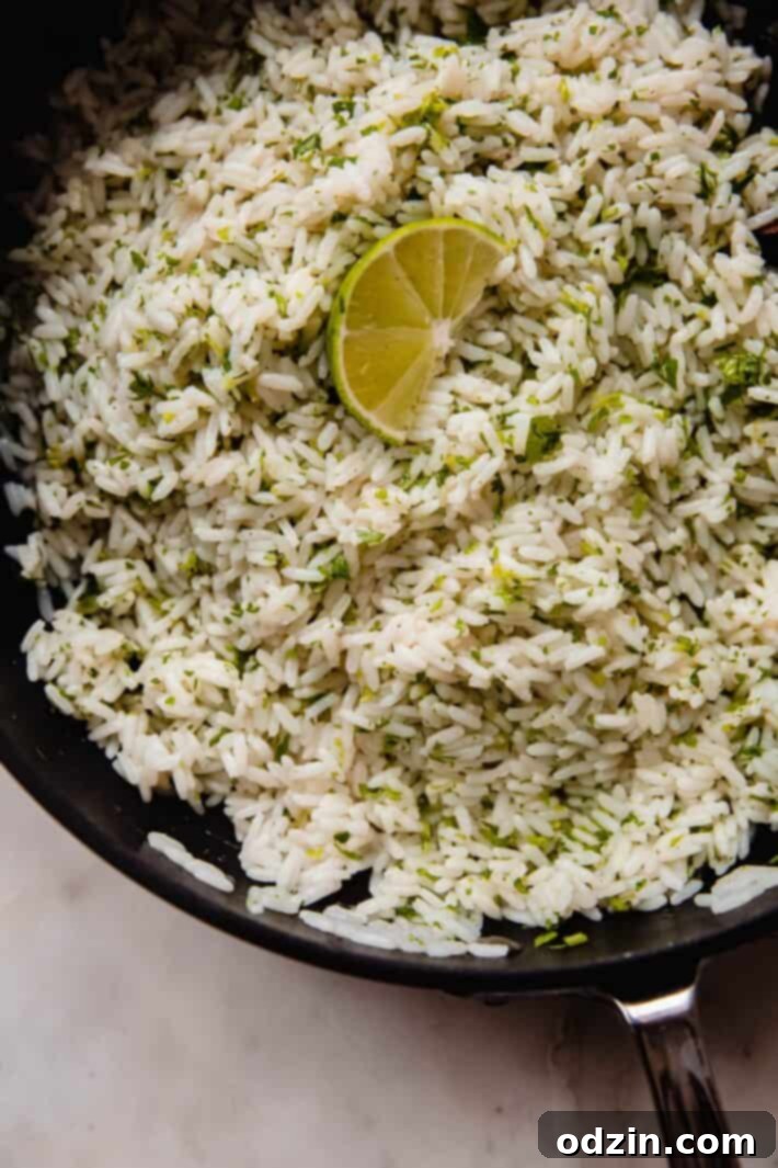 saute pan with prepared cilantro lime rice and lime wedge