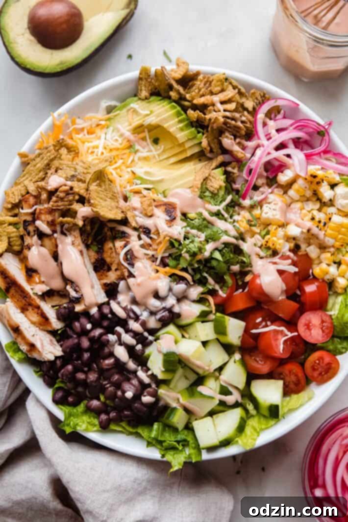 dressed bbq ranch salad in white bowl, perfectly arranged with vibrant colors