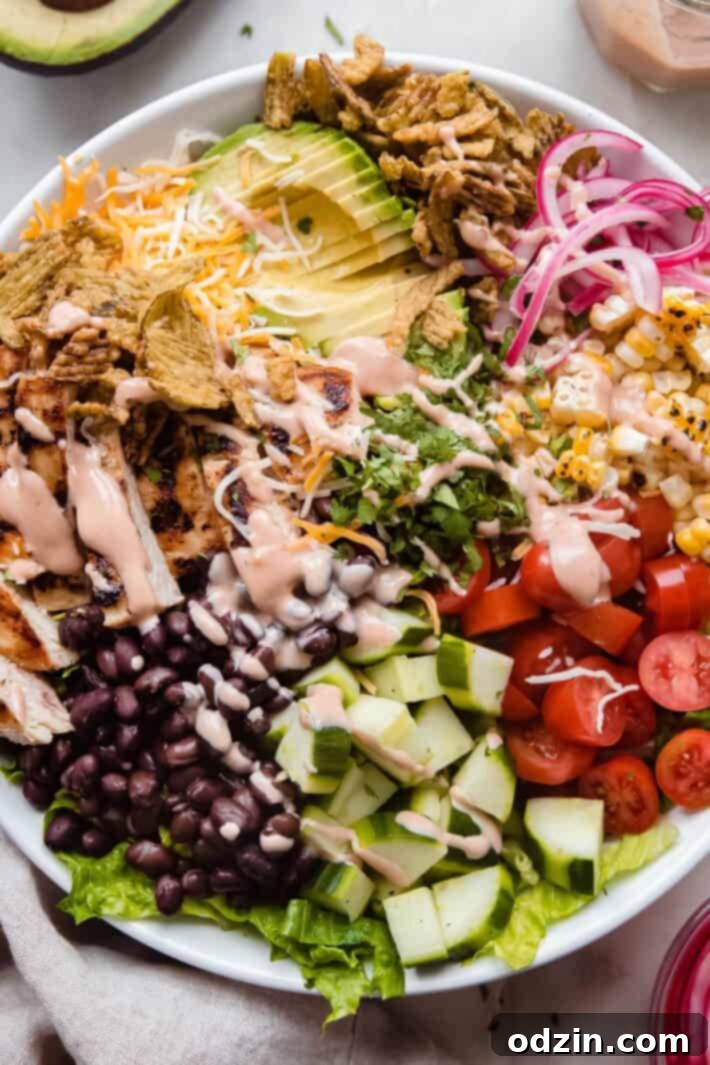 dressed chicken bbq ranch salad in white bowl, ready to be served