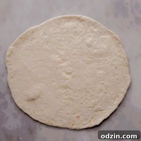 gif showing the processor of how to build a chicken Crunchwrap
