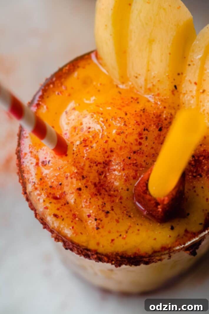Tajin sprinkled generously over a delicious mango sorbet drink