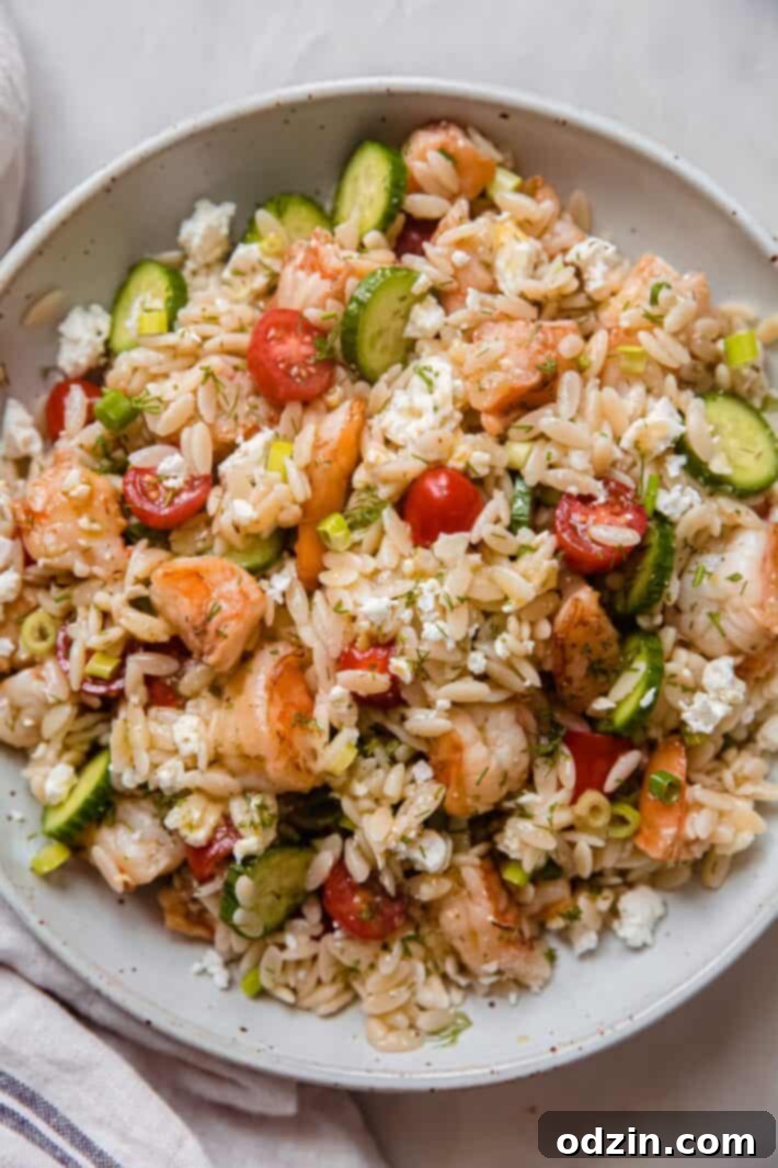 Riviera Prawn & Orzo Bowl 2 Fresh Mediterranean shrimp orzo salad served in a speckled bowl, ready to eat