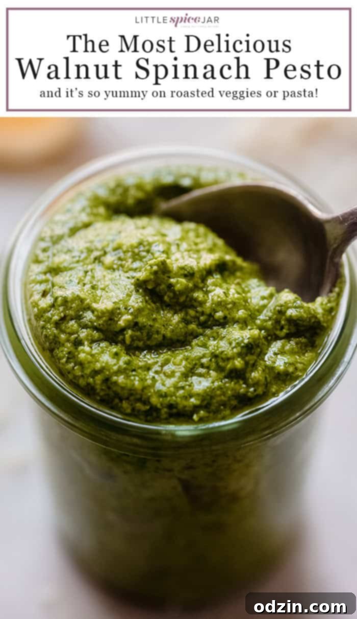 Homemade Walnut Spinach Pesto, a flavorful sauce perfect for many dishes, displayed with fresh ingredients.