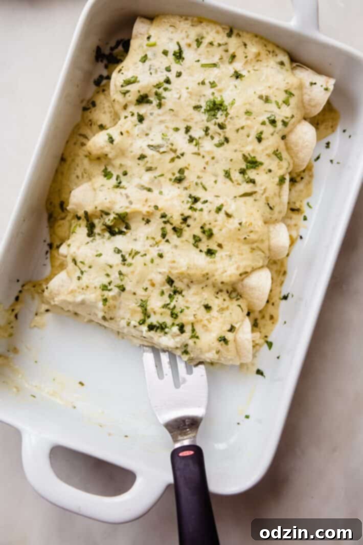 Creamy Salsa Verde Enchiladas 7 white dish with enchiladas missing