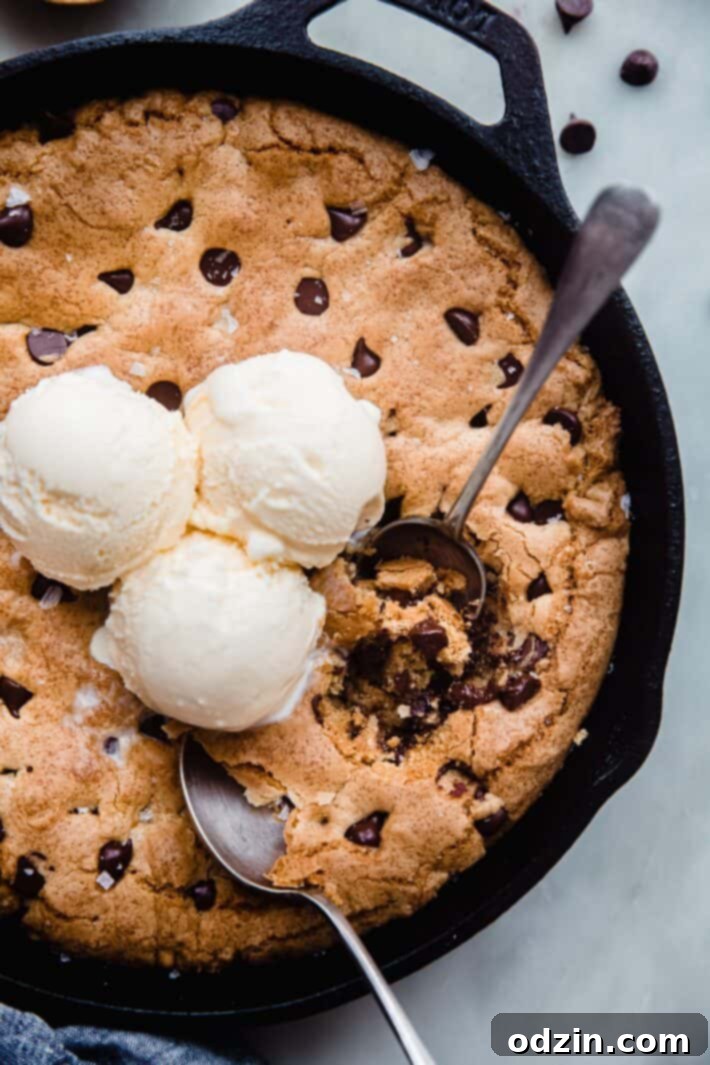 Skillet chocolate chip cookie with a slice taken out