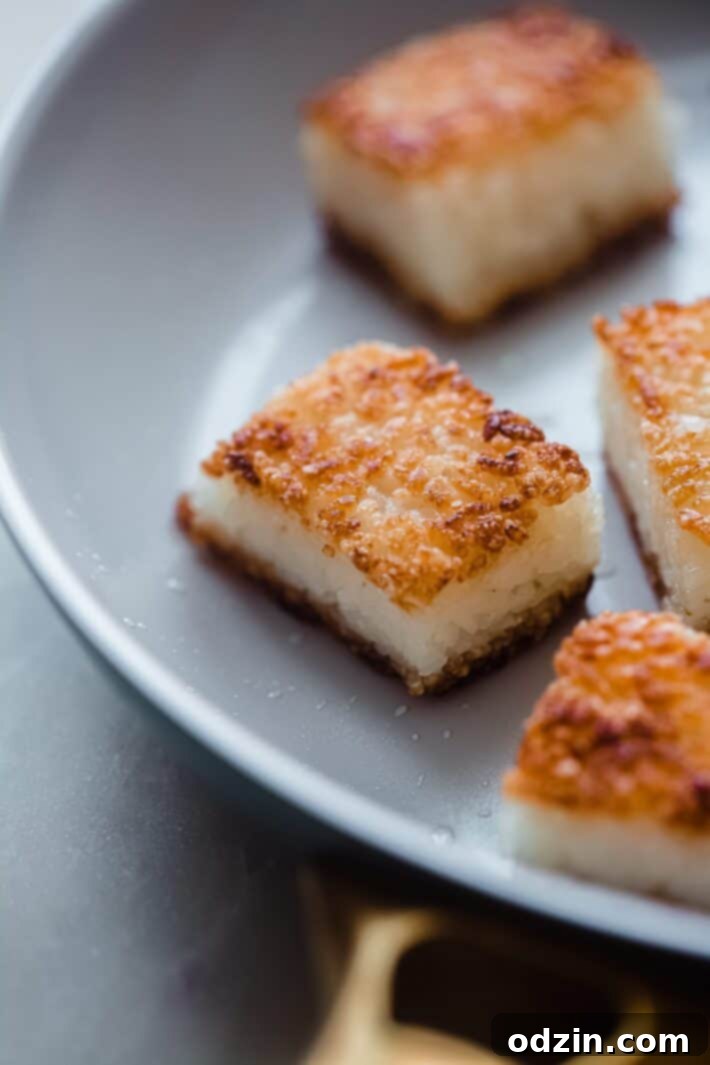 Spicy Salmon Crispy Rice Bites 6 fried crispy rice cakes in skillet