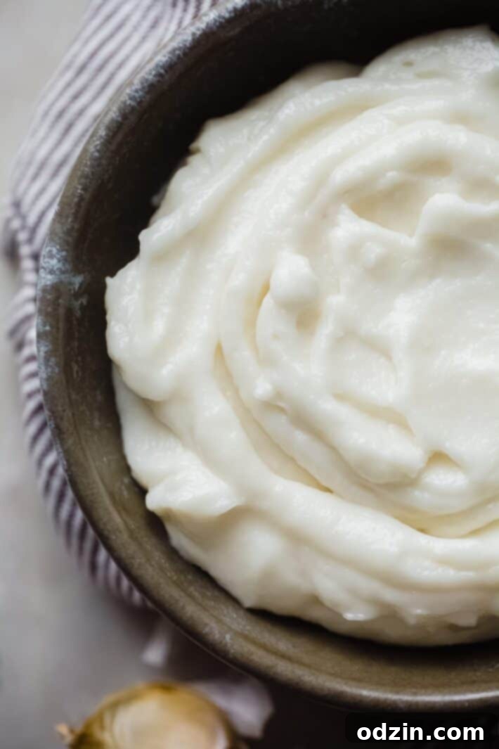 Toum: The Creamy Lebanese Garlic Sauce 3 close up of Lebanese garlic sauce in bowl