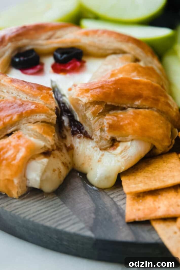 Mummy Brie Bake 3 cut puff pastry brie with brie oozing out