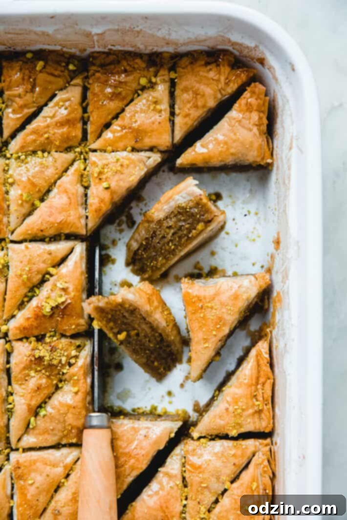 baklava pieces in dish with knife