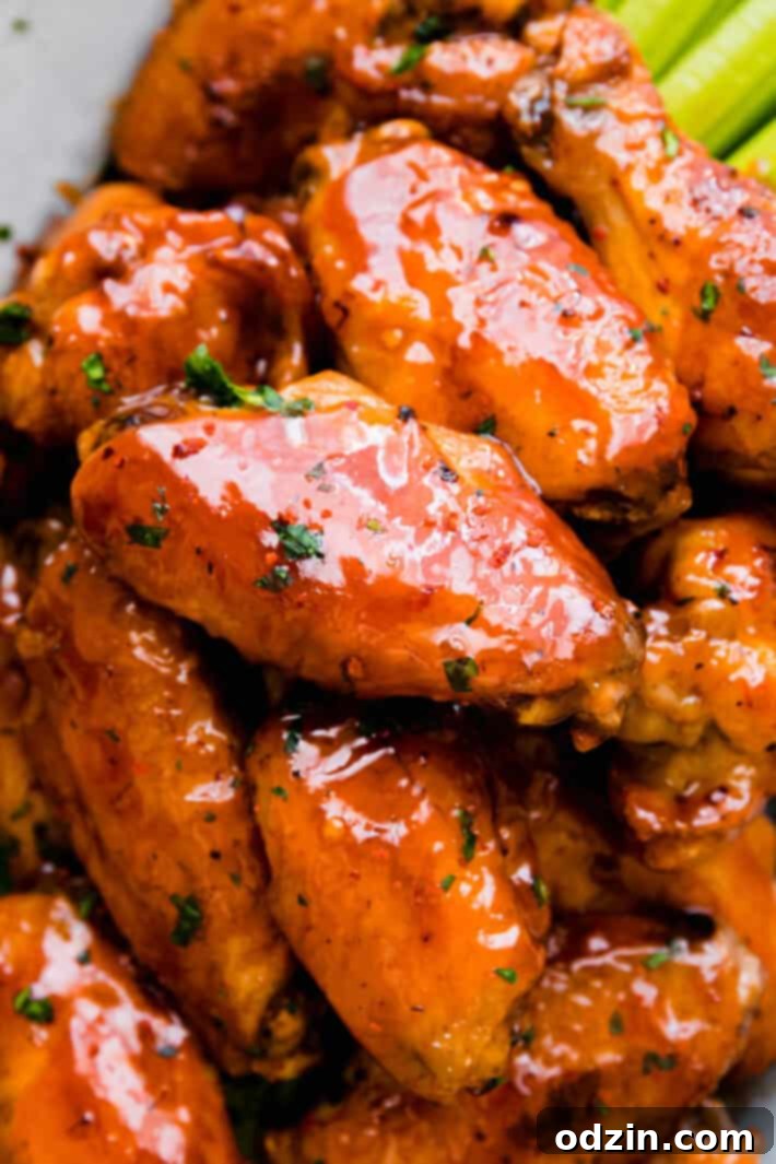 Overview of the firecracker chicken wings arranged on a wooden board, ready for serving.