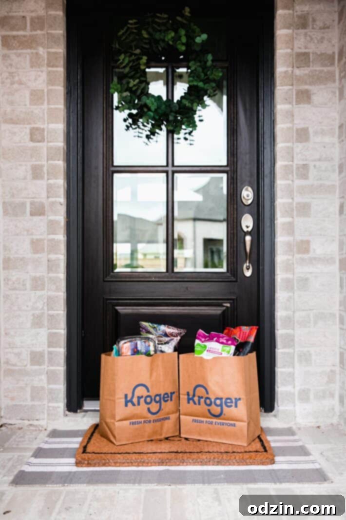 A beautifully arranged selection of snacks, including a chip and dip board with fresh vegetables and fruits, ready for a game night.