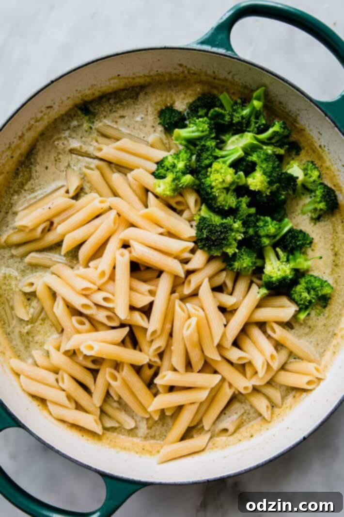 Velvety Pesto Chicken Pasta 4 pesto cream sauce with prepared pasta and broccoli on top