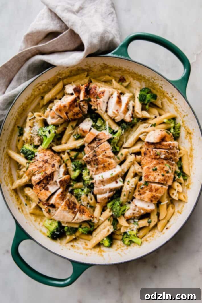 Velvety Pesto Chicken Pasta 6 penne in basil pesto sauce with broccoli and sliced chicken on top