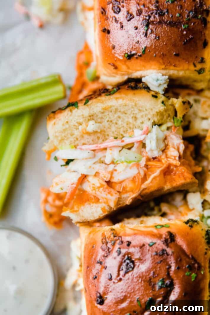 Buffalo Chicken Sliders: Spicy Bites, Creamy Slaw 6 slider on it's side showing layers