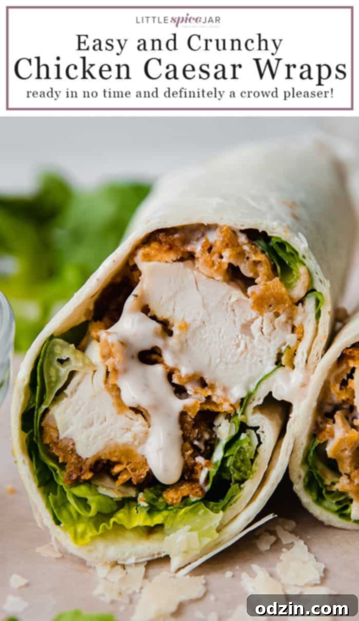 A delicious sliced crunchy chicken caesar wrap, ready to be pinned.