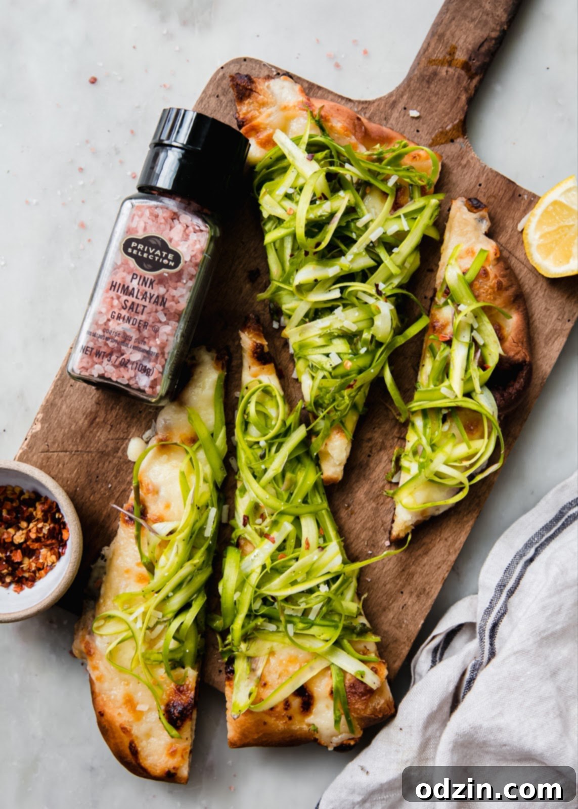 Himalayan sea salt product placement with asparagus pizza