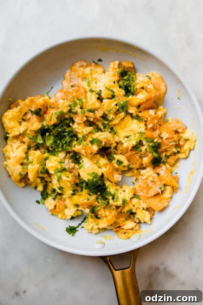migas in a skillet topped with cilantro
