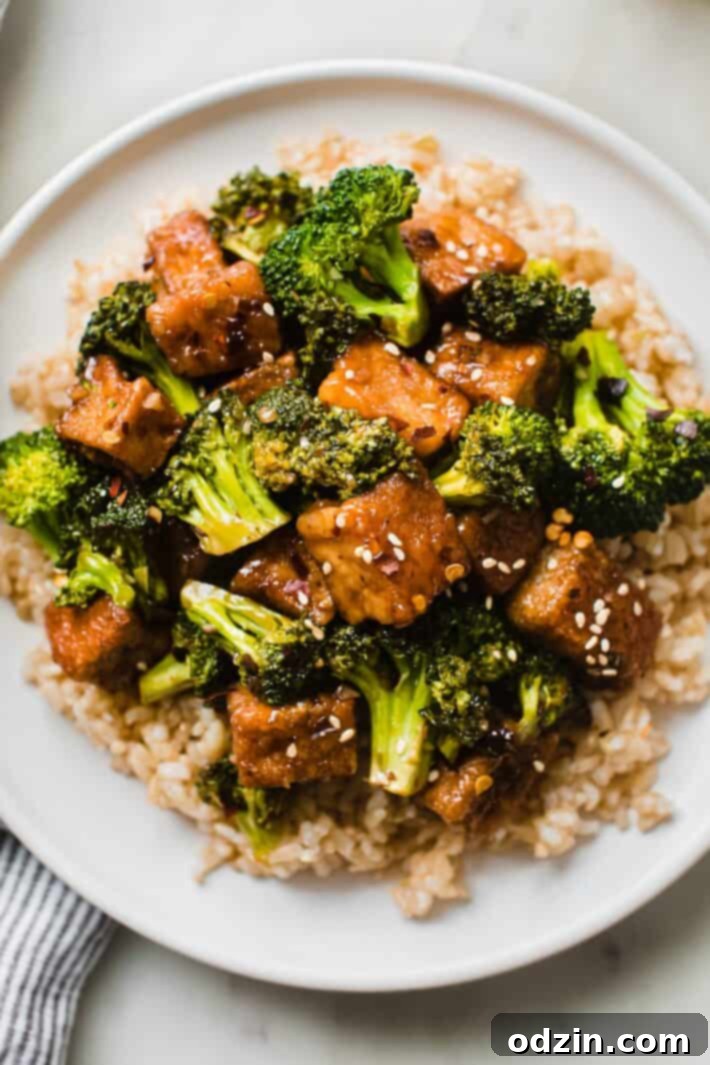 tofu stir fry on plate over brown rice