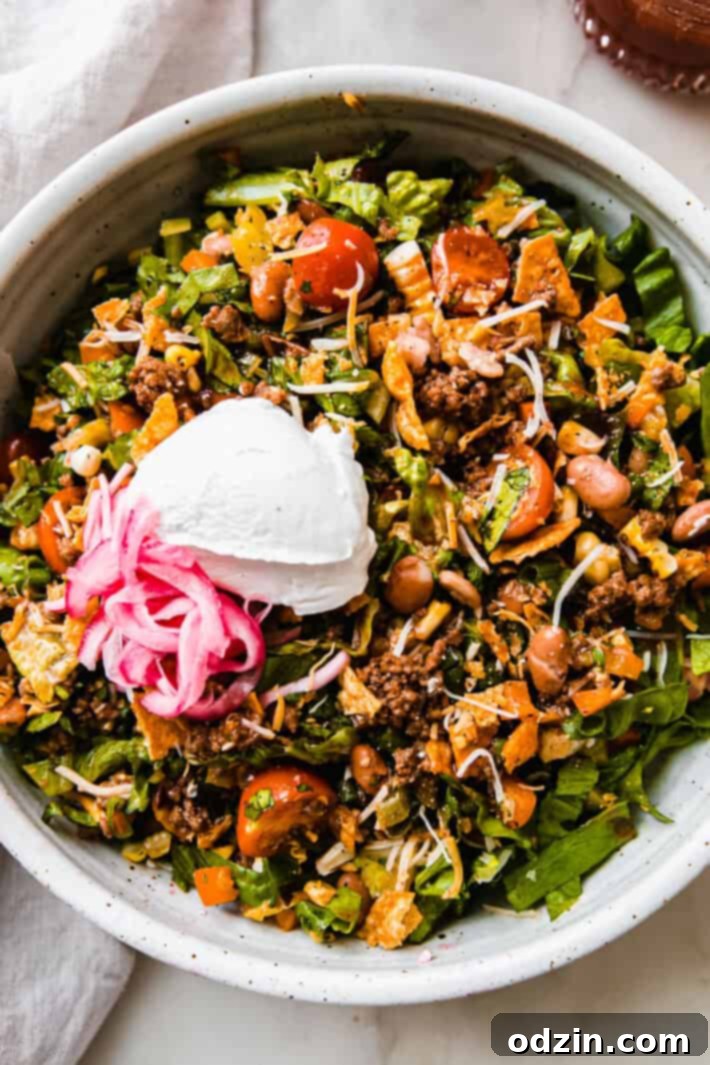 taco salad in speckled bowl 