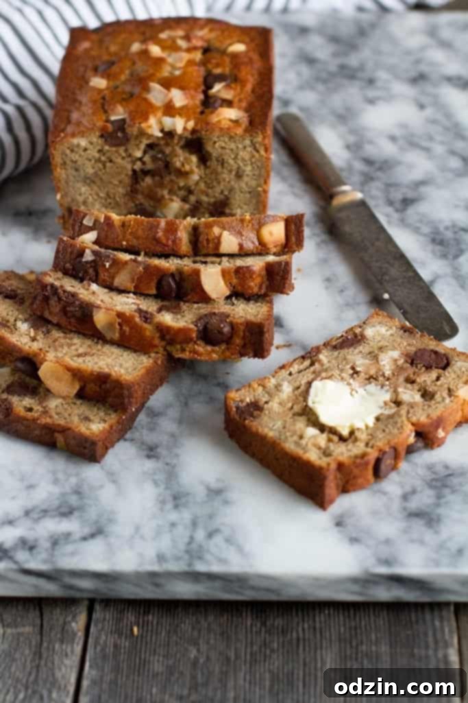 Whole Coconut Chocolate Chip Banana Bread cooling on a wire rack, ready to be sliced and served. #bakingfromscratch #comfortfoodrecipe