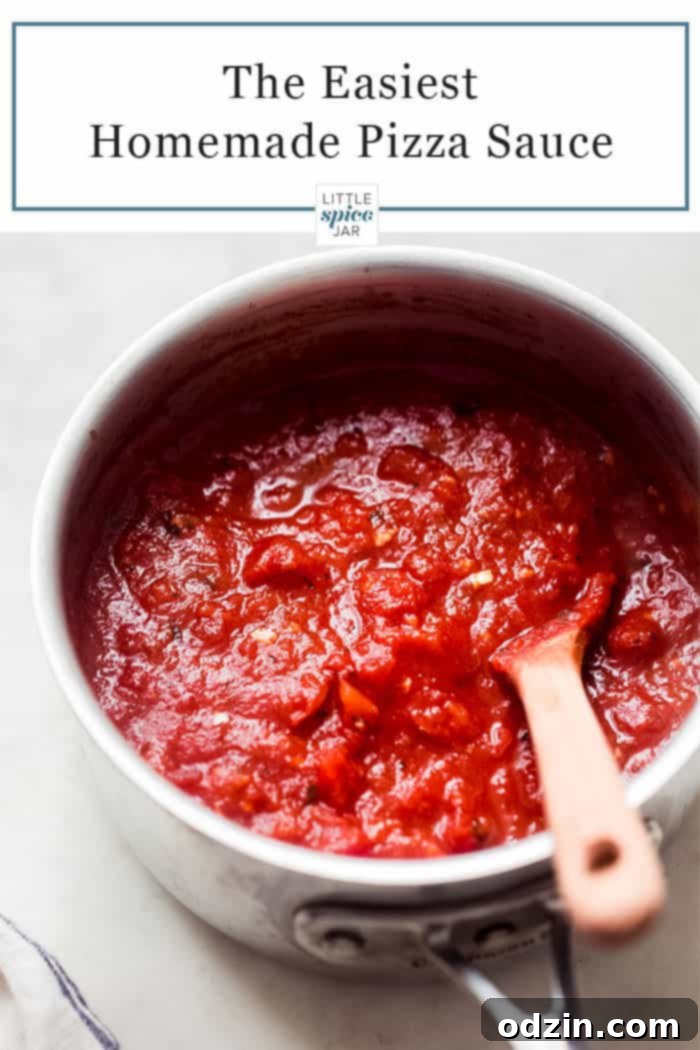 Your New Favorite Homemade Pizza Sauce 4 saucepan with pizza sauce and a wooden spoon