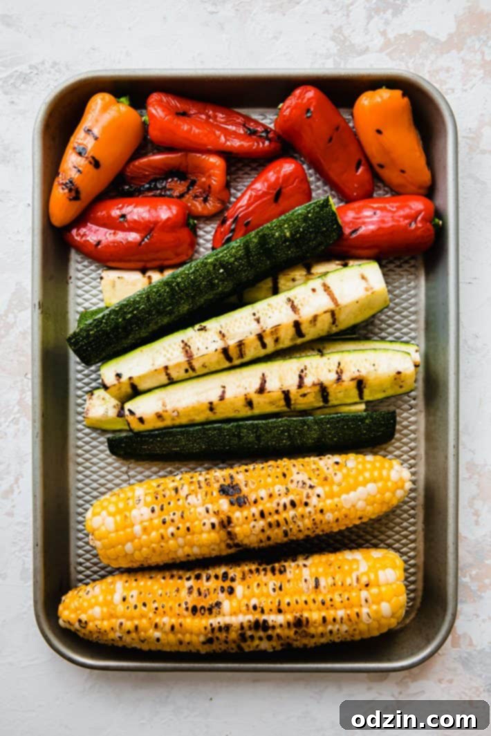 Smoky Grilled Zucchini and Sweet Corn Salad with Bell Peppers 4 Grilled sweet peppers, zucchini spears, and corn cobs on sheet pan