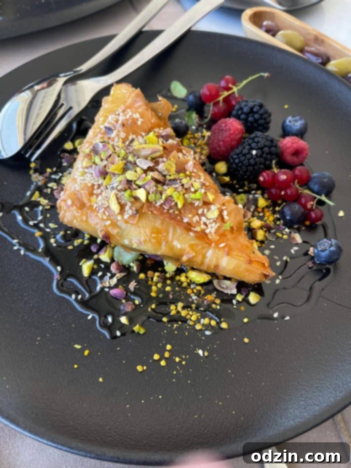 Feta cheese wrapped in filo pastry, drizzled with honey and fresh berries