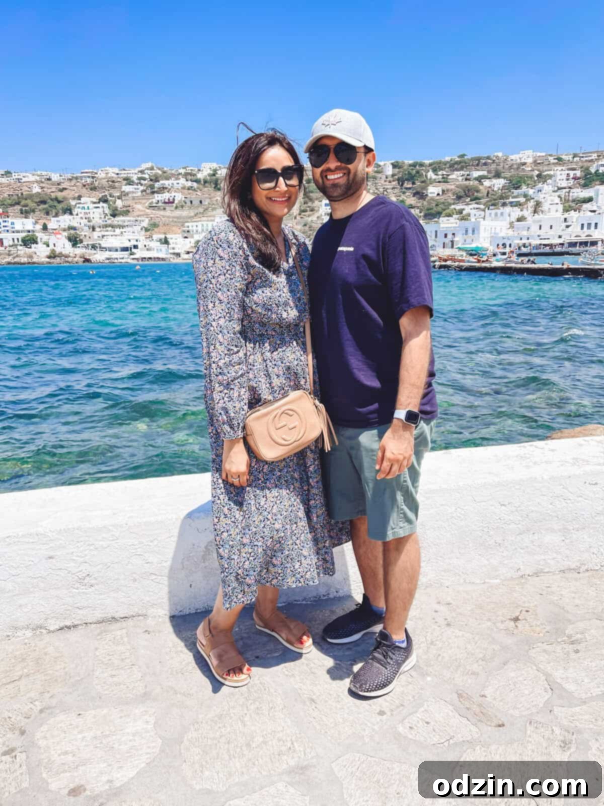 Couple in the old port of Mykonos, enjoying the scenery
