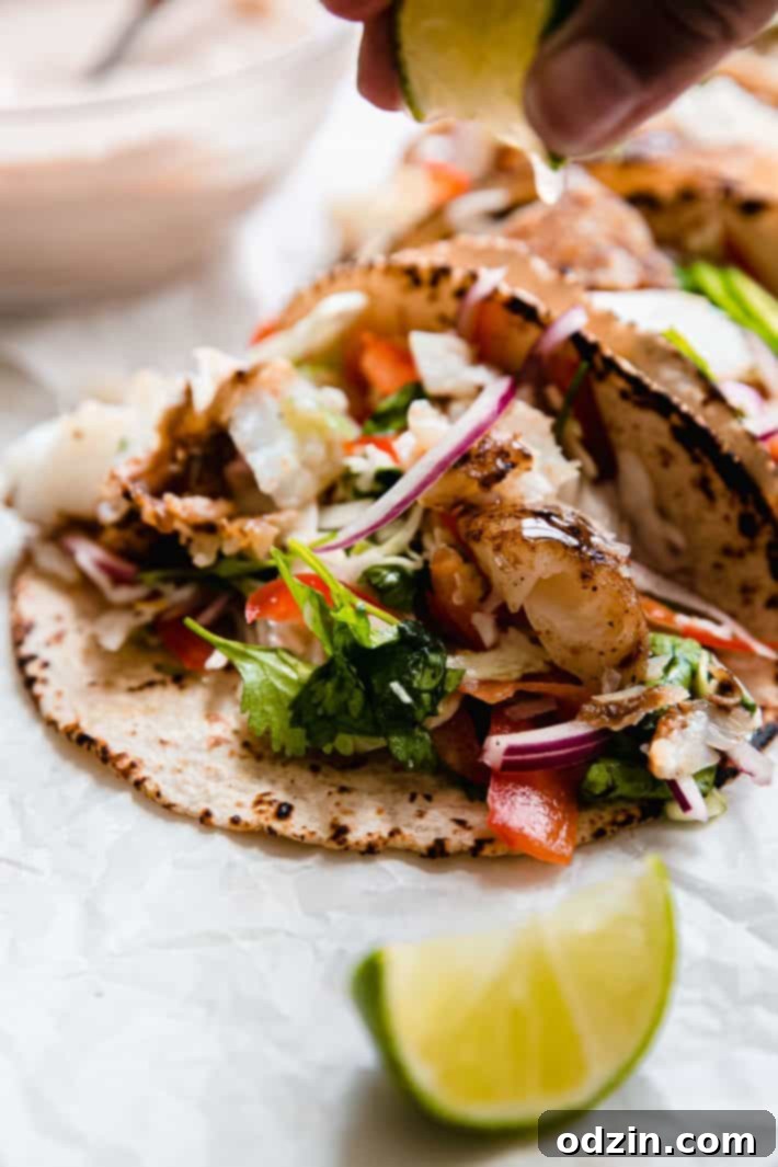 squeezing lime on fish taco