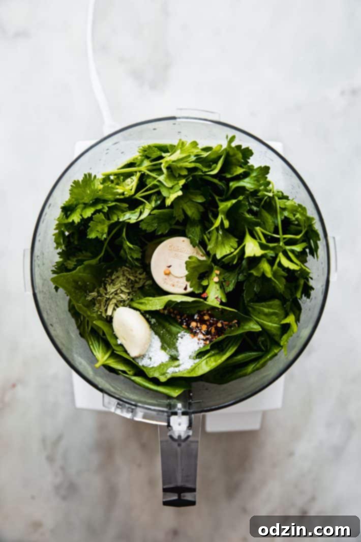Vibrant Fresh Herb Dressing and Marinade 4 Ingredients for fresh herb vinaigrette in a food processor, before blending
