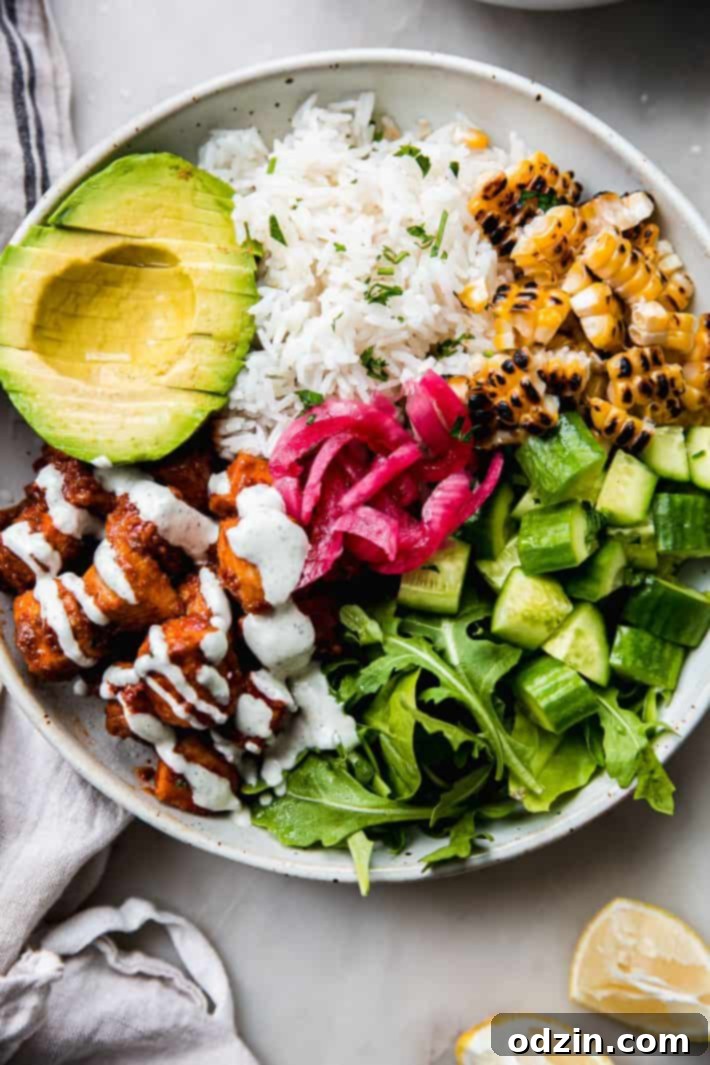 Vibrant Honey Harissa Chicken Bowls with Cooling Feta Mint 2 Cava bowl with honey harissa chicken and toppings