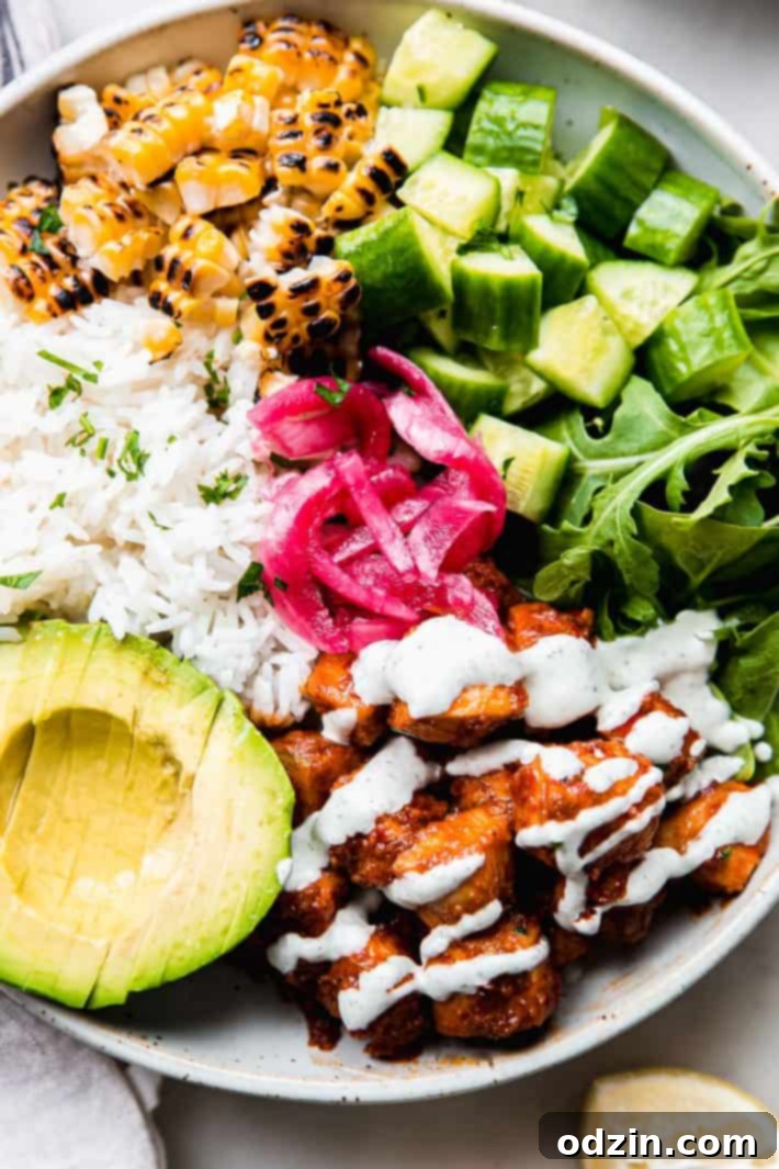 Vibrant Honey Harissa Chicken Bowls with Cooling Feta Mint 8 Sauced honey harissa chicken bowl close up