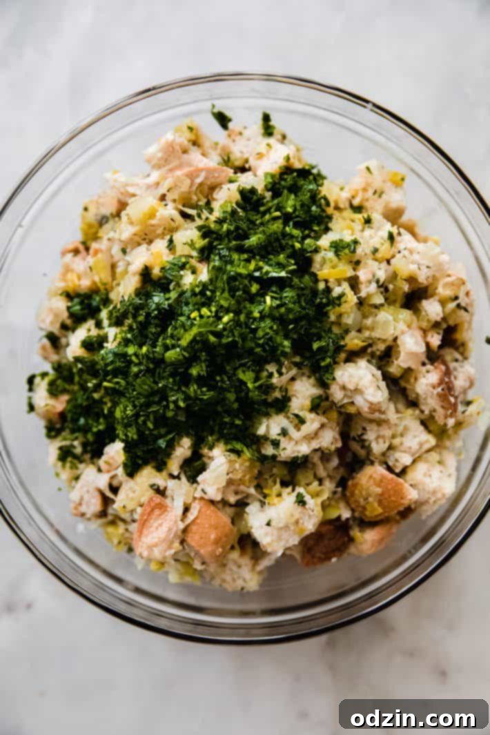 bread and sautéed mixture in bowl with parsley